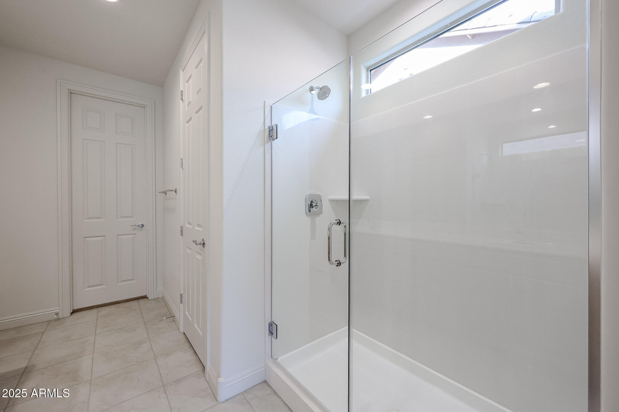 7072 West Oberlin Way Peoria, AZ 85383 - Photo 13 of 24 a bathroom with a shower and a glass door