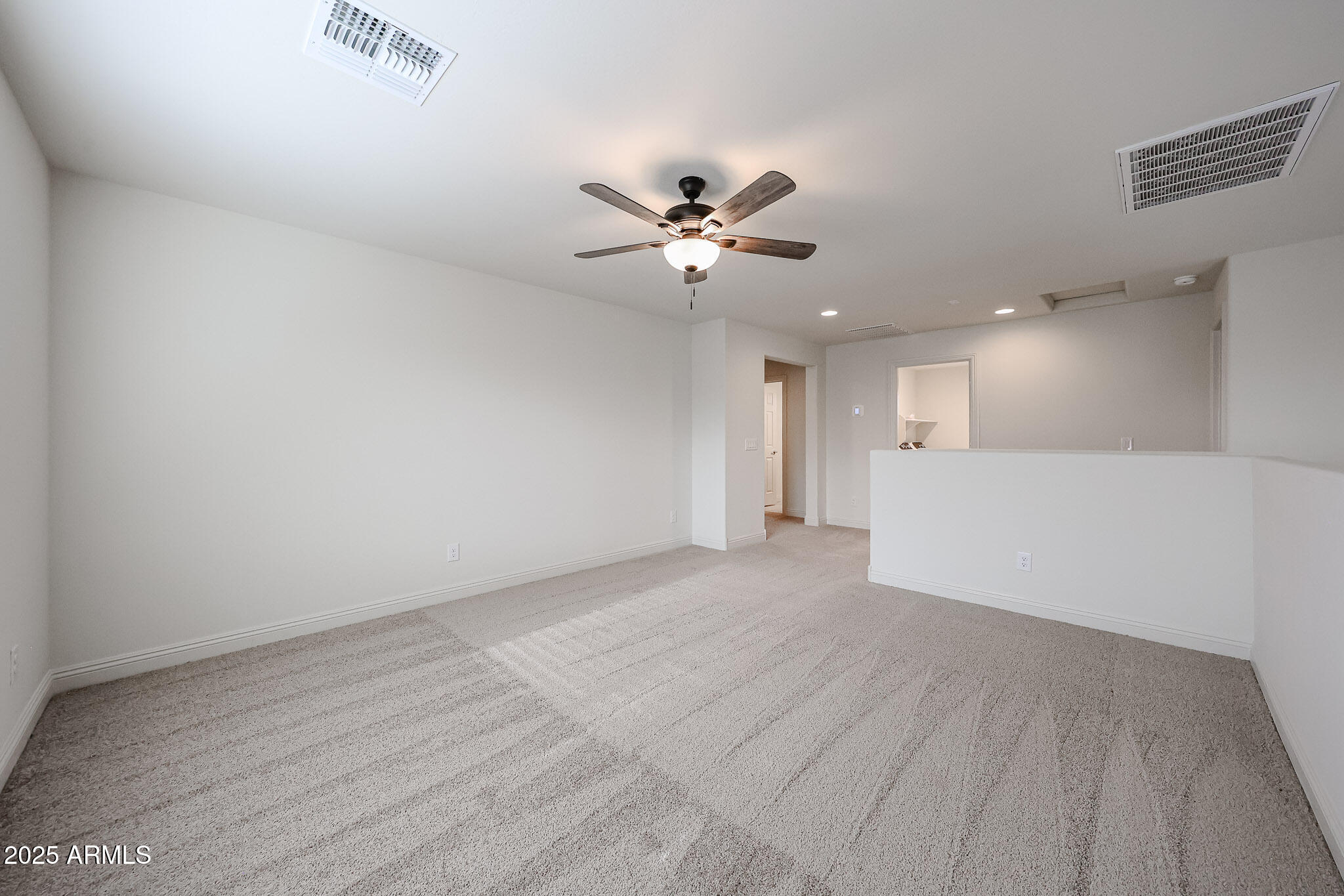 7072 West Oberlin Way Peoria, AZ 85383 - Photo 15 of 24 wooden floor in an empty room