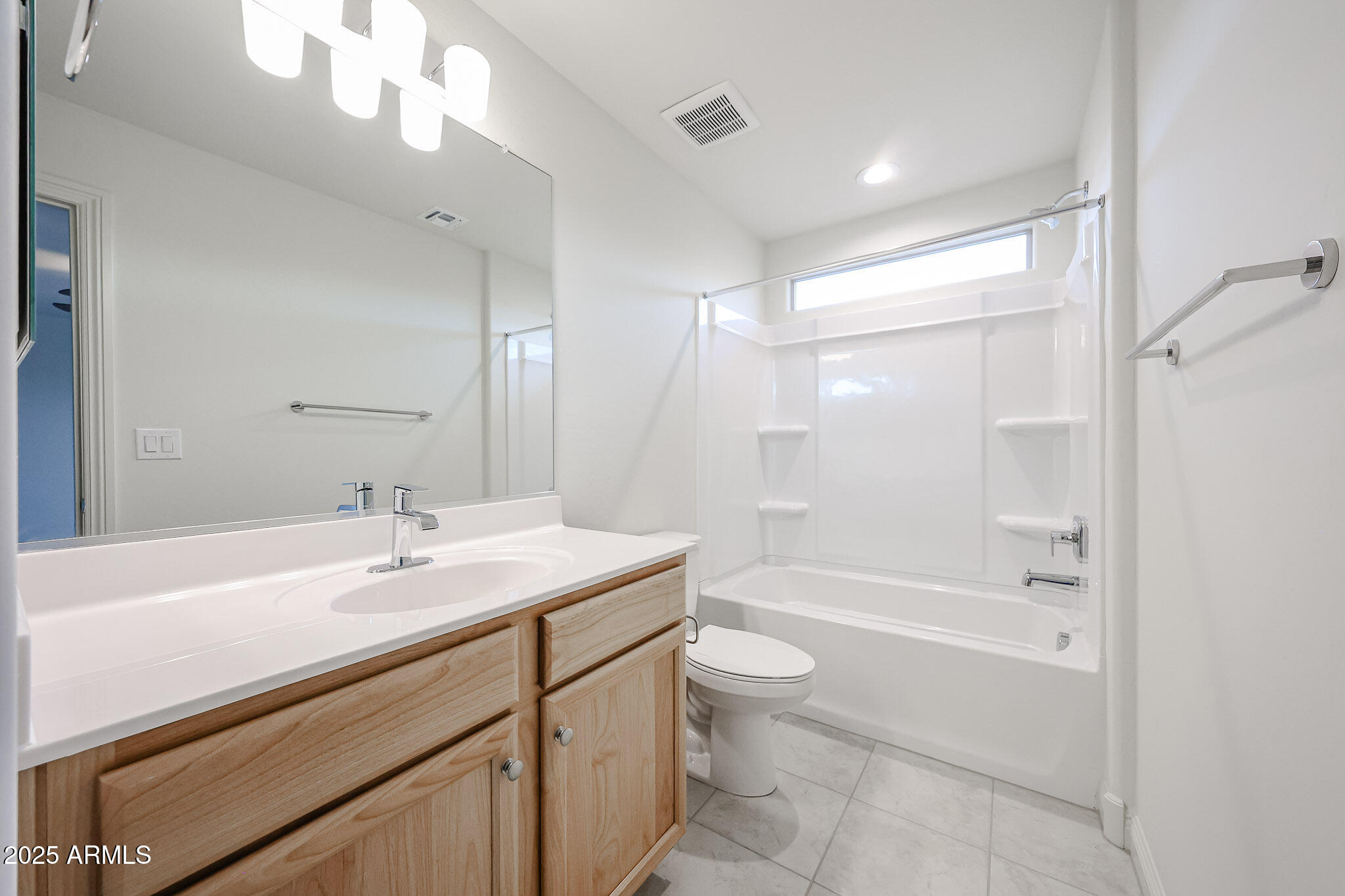 7072 West Oberlin Way Peoria, AZ 85383 - Photo 17 of 24 a bathroom with a bathtub shower sink vanity and toilet