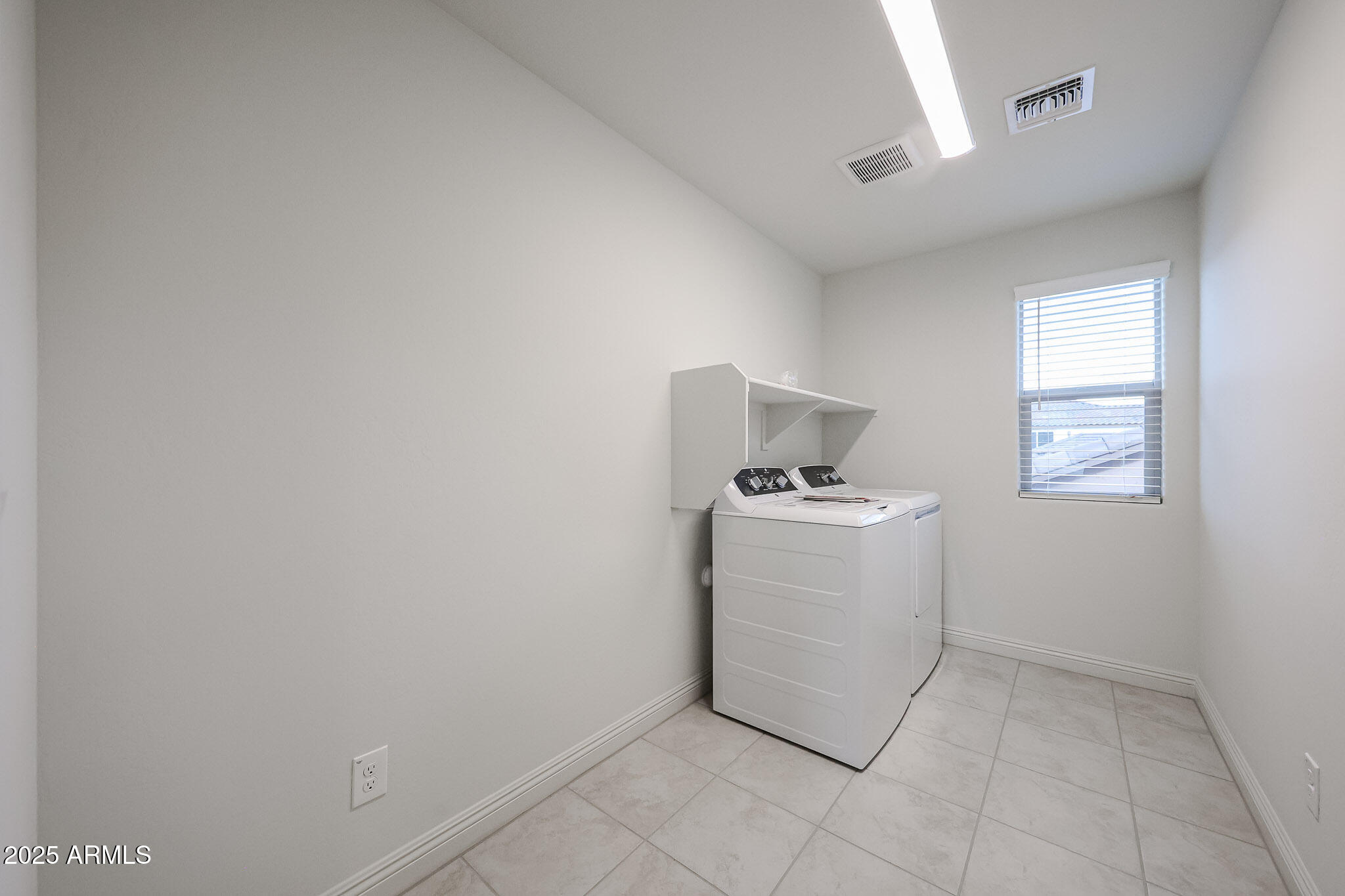 7072 West Oberlin Way Peoria, AZ 85383 - Photo 21 of 24 a room with a washer and dryer