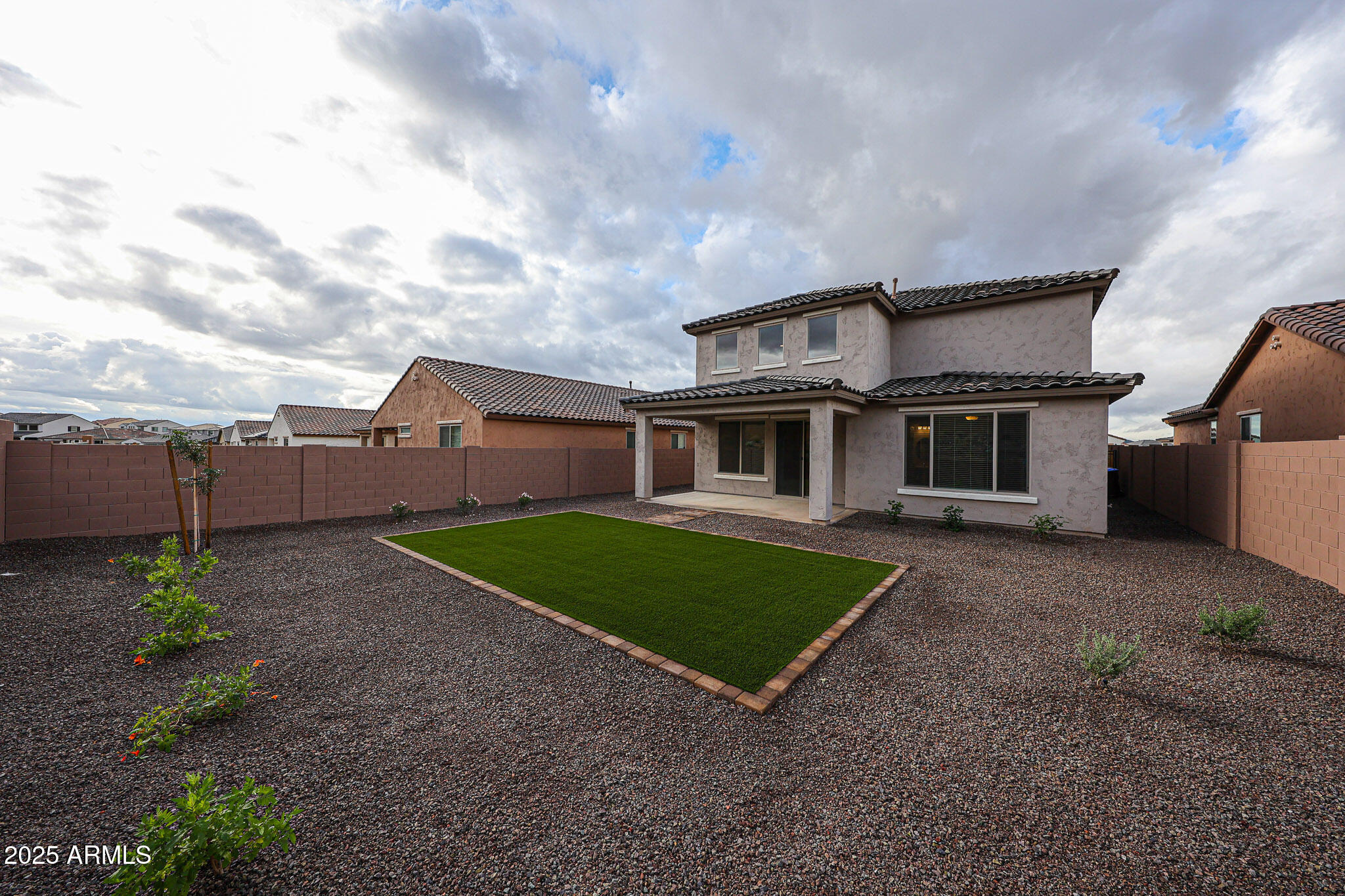 7072 West Oberlin Way Peoria, AZ 85383 - Photo 22 of 24 a front view of a house with garden