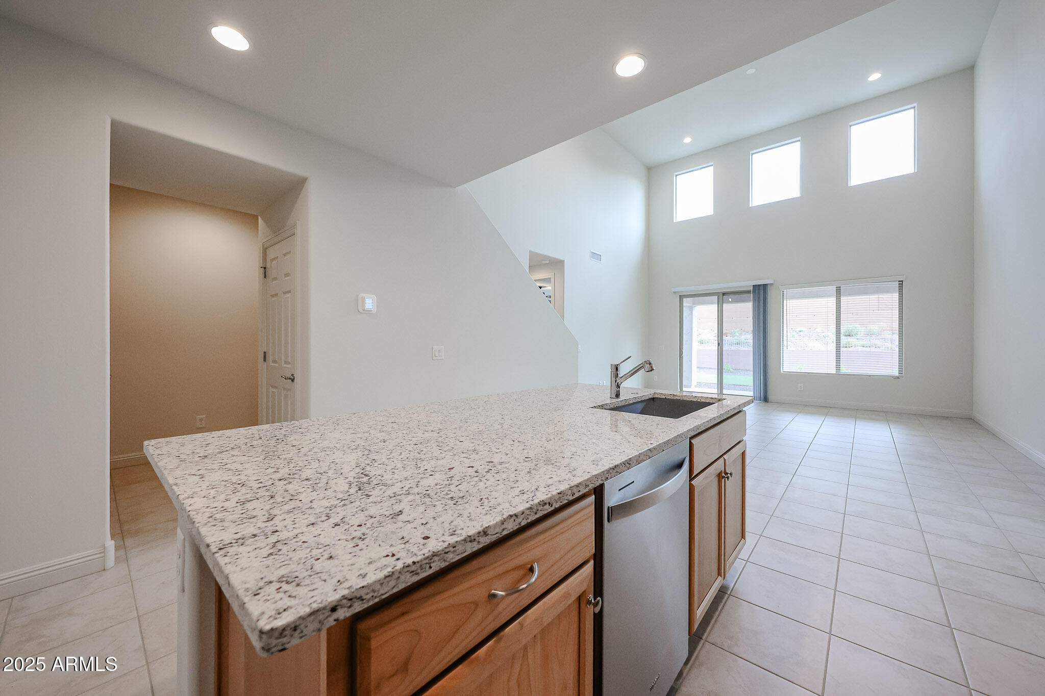 7072 West Oberlin Way Peoria, AZ 85383 - Photo 5 of 24 a kitchen with a sink a counter space and wooden floor