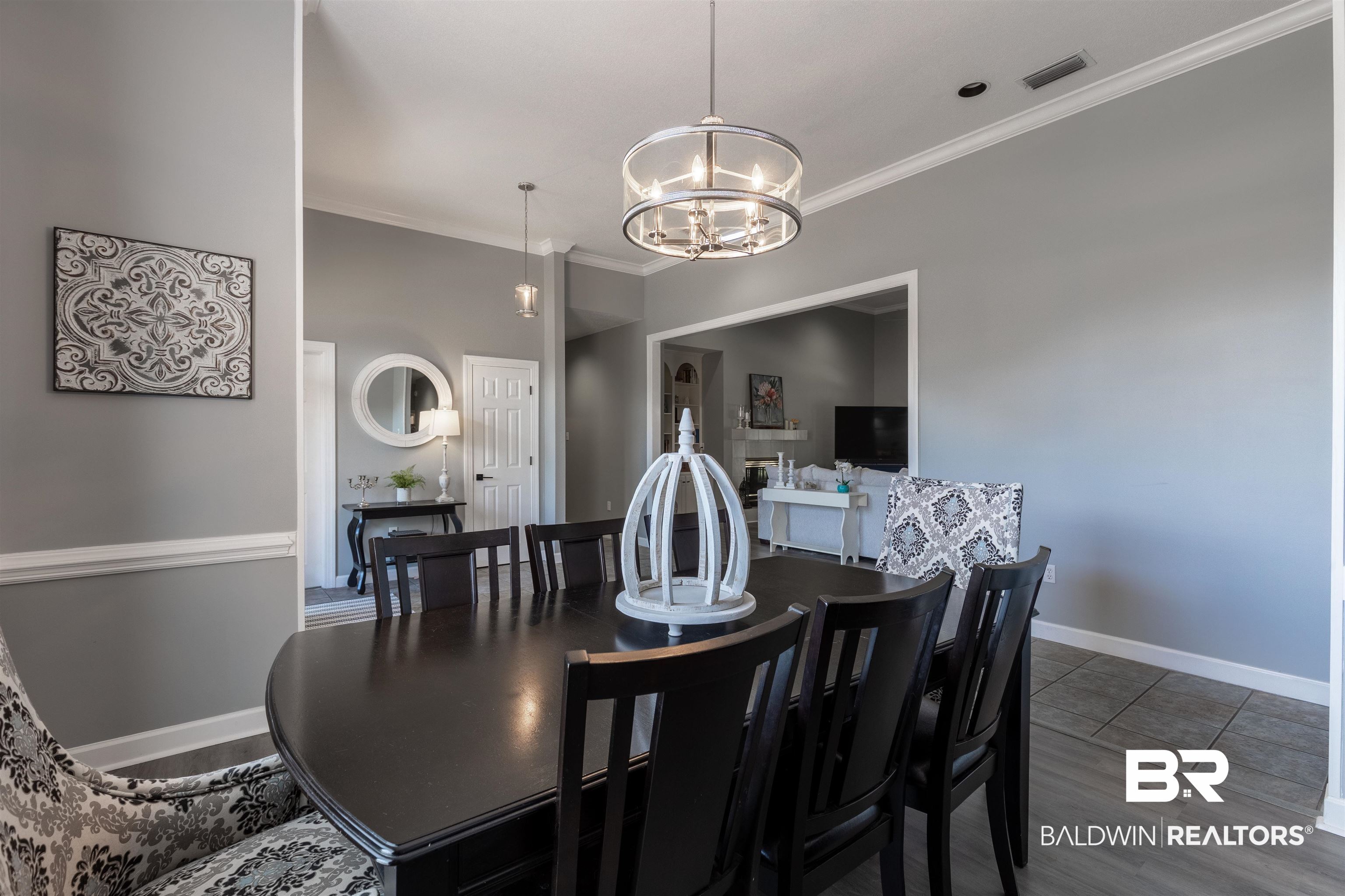 6436 Cherry Ridge Court West Mobile, AL 36695 - Photo 5 of 26 Dining room featuring baseboards, visible vents, ornamental molding, and a chandelier