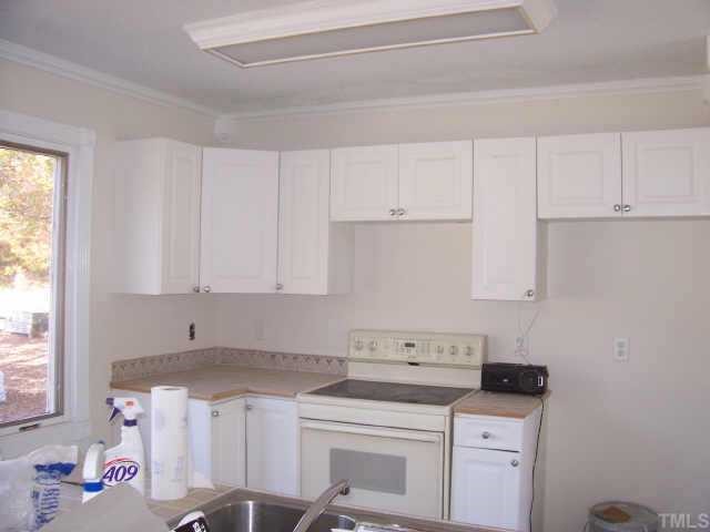 7190 Buffalo Road Selma, NC 27576 - Photo 3 of 6 kitchen has new cabinets, counter tops, floors & appliances