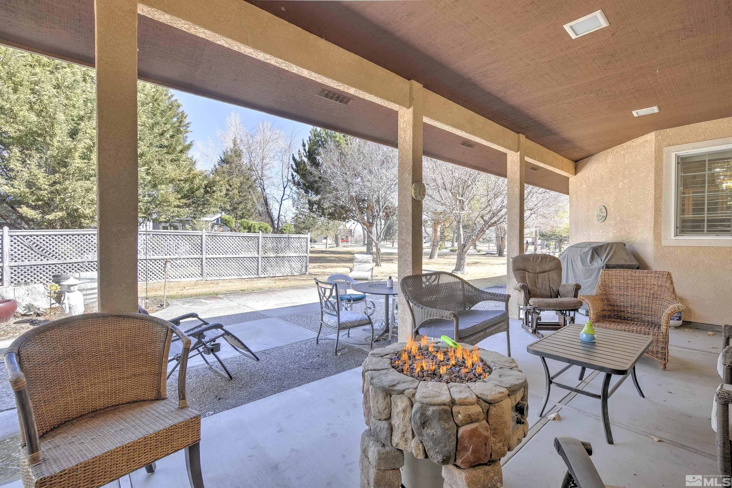 5650 Rivers Edge Drive Fallon, NV 89406 - Photo 31 of 35 a living room with furniture and floor to ceiling windows