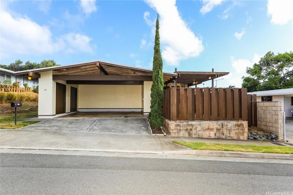 a view of a house with a yard and garage