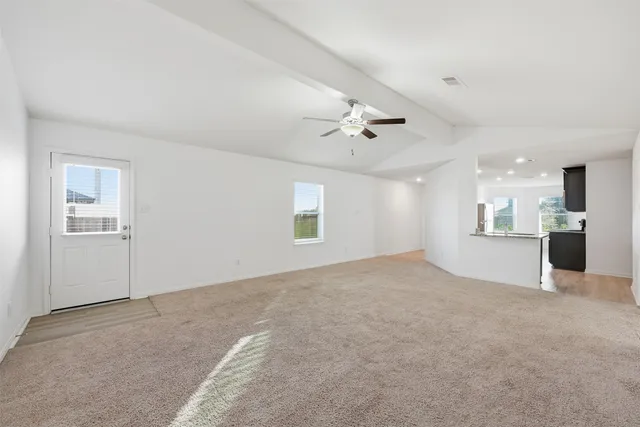 a view of a kitchen with a sink and a window