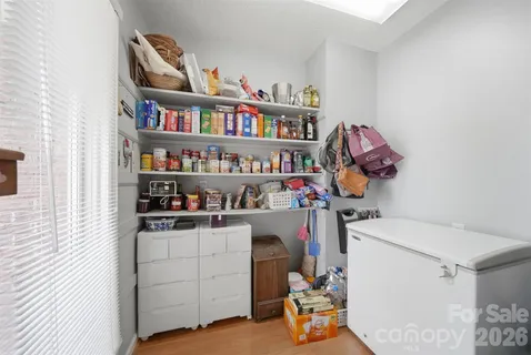 a room with furniture and a book shelf