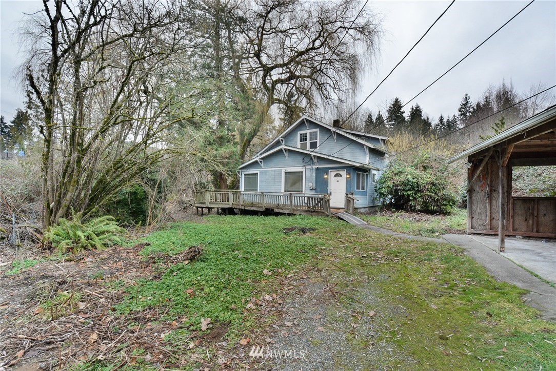 23004 Bothell Everett Highway Bothell, WA 98021 - Photo 5 of 23 a house view with a garden space