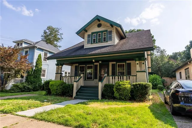 a front view of a house with garden