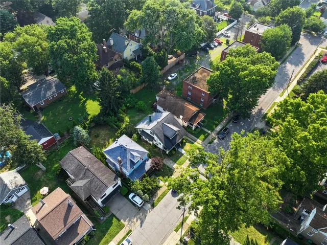 an aerial view of residential house with outdoor space and street view