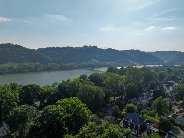 an aerial view of lake and mountain view