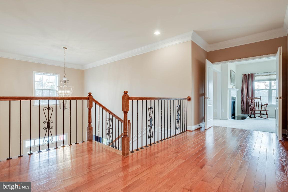 41985 Riding Mill Place Ashburn, VA 20148 - Photo 36 of 46 Upper Hallway with Hardwood Flooring
