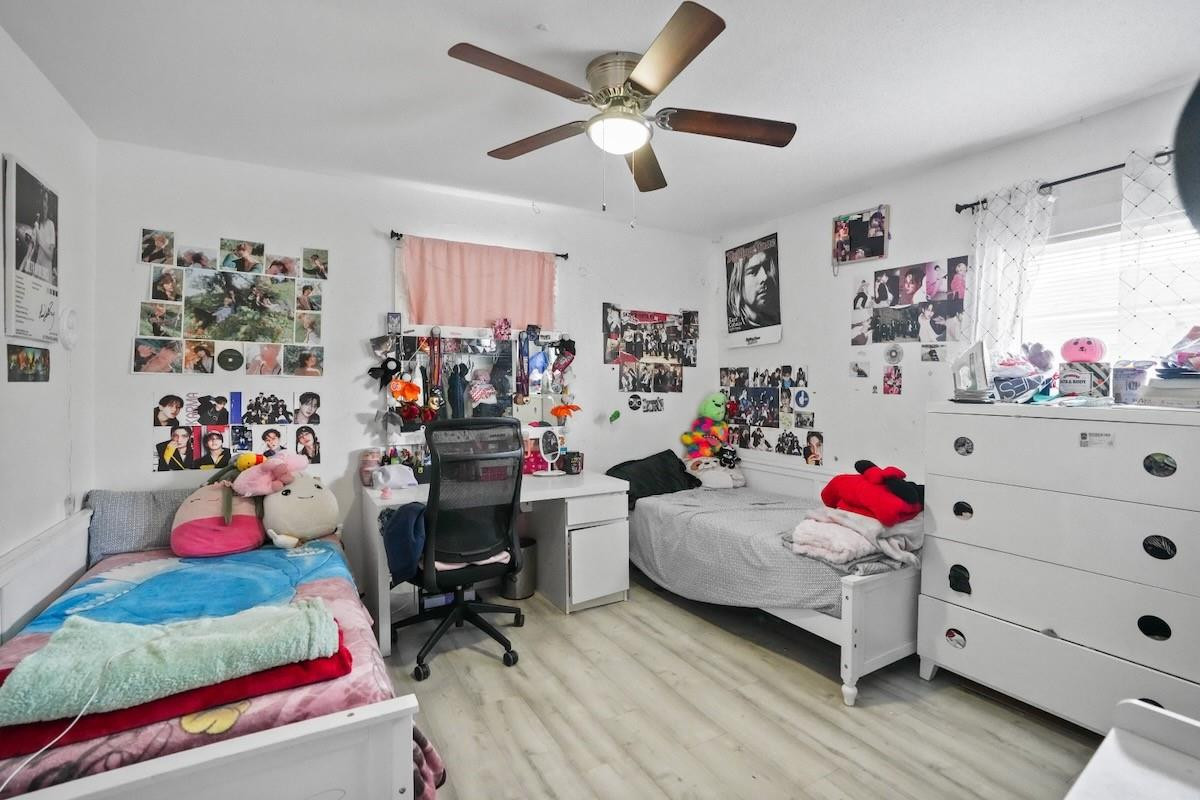 708 Northwest 15th Street Homestead, FL 33030 - Photo 15 of 32 a bedroom with baby toys and a large window