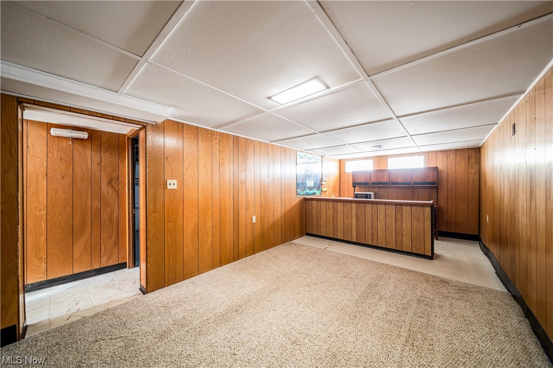 648 Pendley Road Willowick, OH 44095 - Photo 19 of 35 Basement with wood walls and light carpet