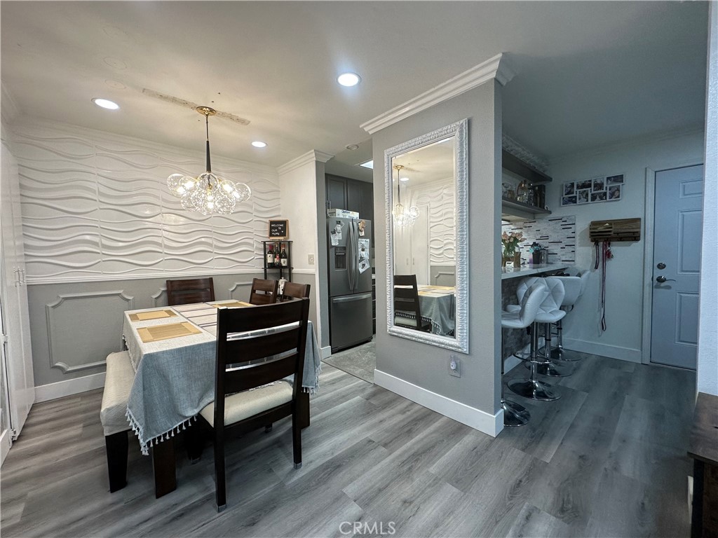 a view of a livingroom with furniture and hardwood floor