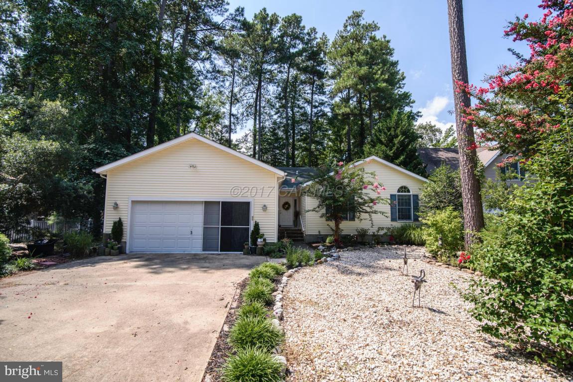 17 Mist Flower Road Ocean Pines, MD 21811 - Photo 1 of 49 a front view of a house with a yard and garage