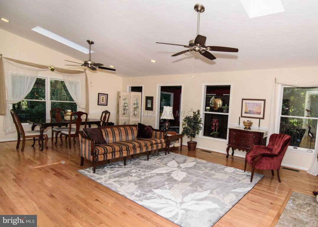 17 Mist Flower Road Ocean Pines, MD 21811 - Photo 2 of 49 a living room filled with furniture and a wooden floor
