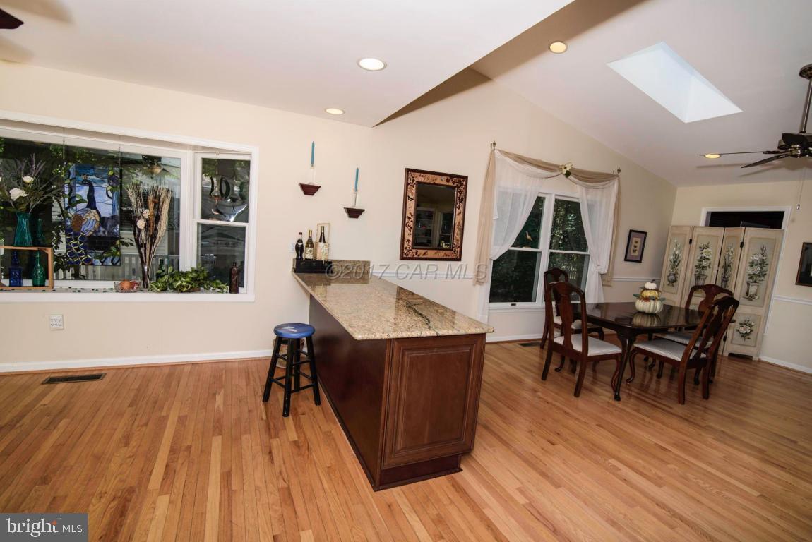 17 Mist Flower Road Ocean Pines, MD 21811 - Photo 14 of 49 a living room with furniture a wooden floor and a table