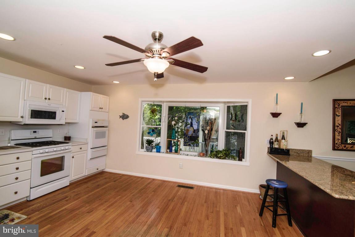 17 Mist Flower Road Ocean Pines, MD 21811 - Photo 15 of 49 a view of a kitchen with microwave and stove