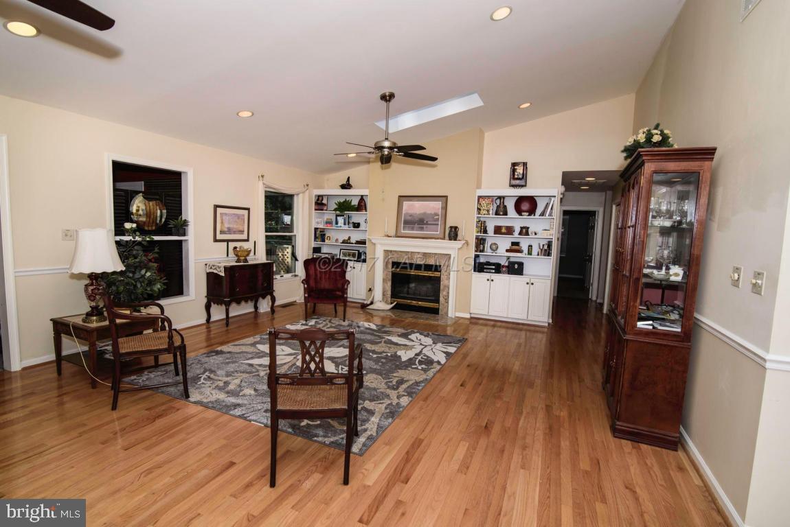17 Mist Flower Road Ocean Pines, MD 21811 - Photo 17 of 49 a living room with furniture flat screen tv and a fireplace
