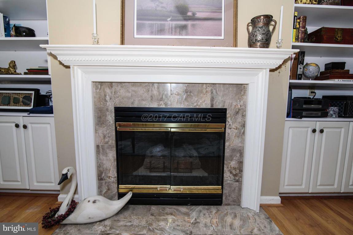 17 Mist Flower Road Ocean Pines, MD 21811 - Photo 20 of 49 a stove top oven sitting inside of a kitchen and wooden floor