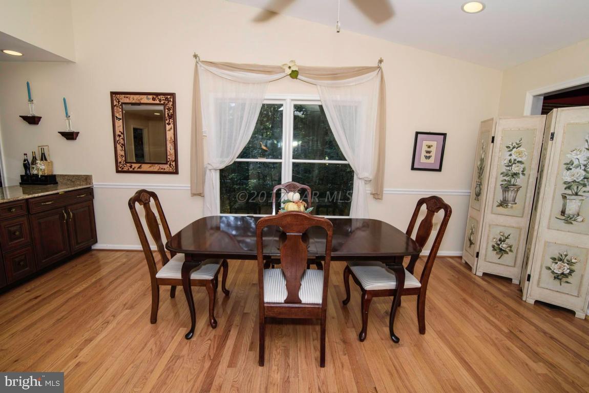 17 Mist Flower Road Ocean Pines, MD 21811 - Photo 3 of 49 a view of a dining room with furniture and wooden floor