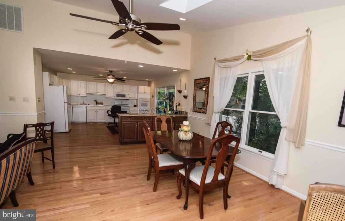17 Mist Flower Road Ocean Pines, MD 21811 - Photo 21 of 49 a dining room with furniture a chandelier and wooden floor