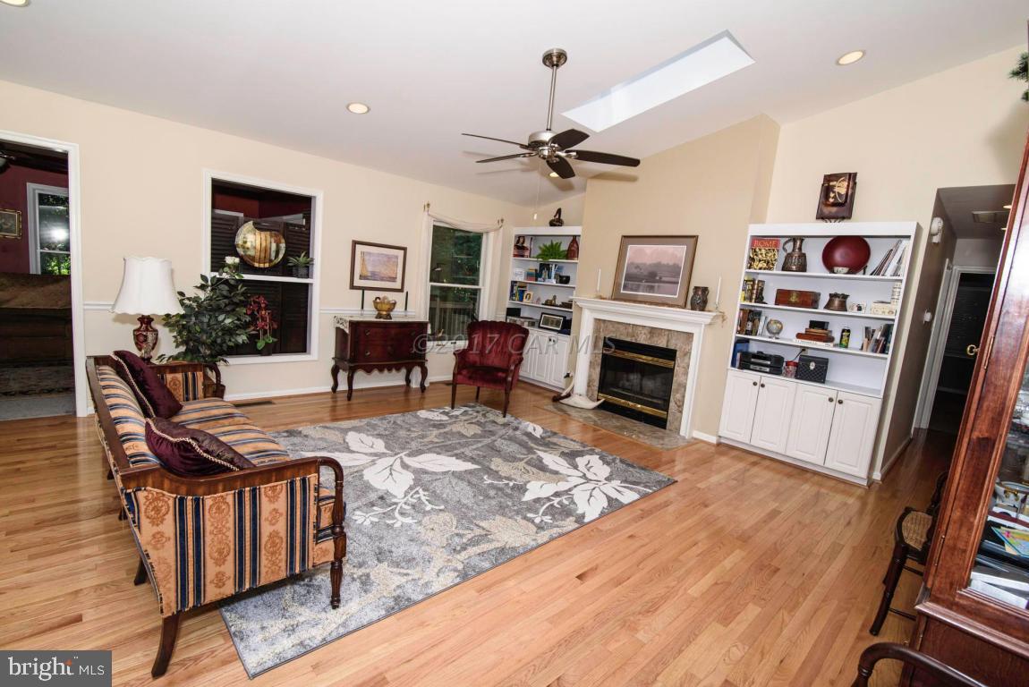 17 Mist Flower Road Ocean Pines, MD 21811 - Photo 22 of 49 a living room with furniture a flat screen tv and a fireplace