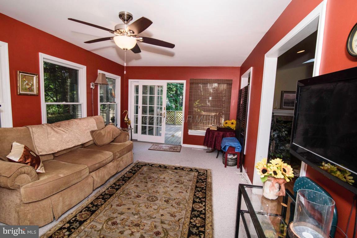 17 Mist Flower Road Ocean Pines, MD 21811 - Photo 24 of 49 a living room with furniture and a flat screen tv