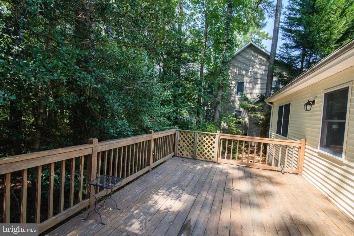 17 Mist Flower Road Ocean Pines, MD 21811 - Photo 27 of 49 a view of a wooden deck and a yard with wooden fence