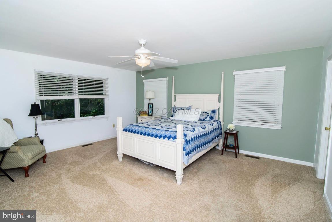 17 Mist Flower Road Ocean Pines, MD 21811 - Photo 28 of 49 a bedroom with a bed a window and couch