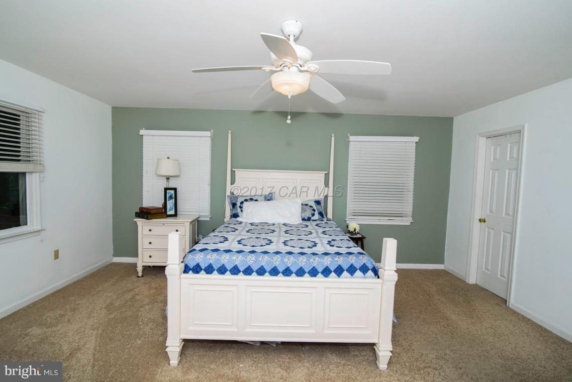 17 Mist Flower Road Ocean Pines, MD 21811 - Photo 30 of 49 a bedroom with a bed and window