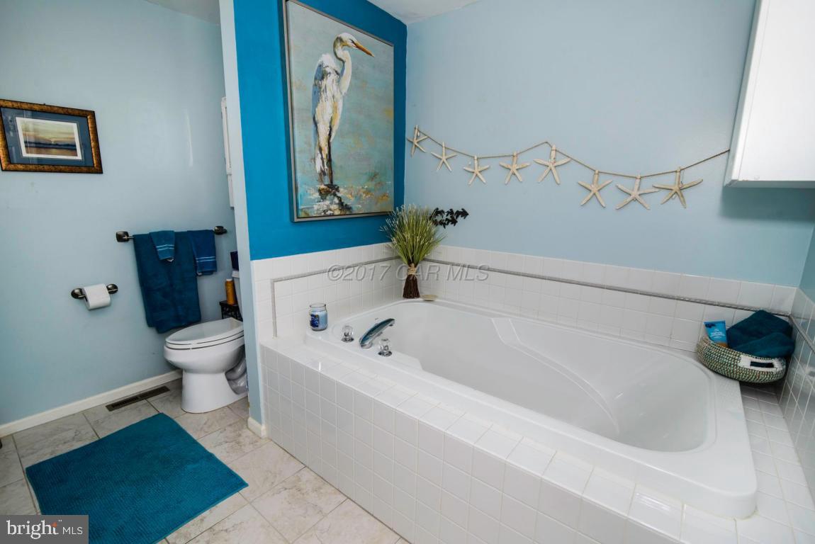 17 Mist Flower Road Ocean Pines, MD 21811 - Photo 34 of 49 a bathroom with a toilet and a bathtub