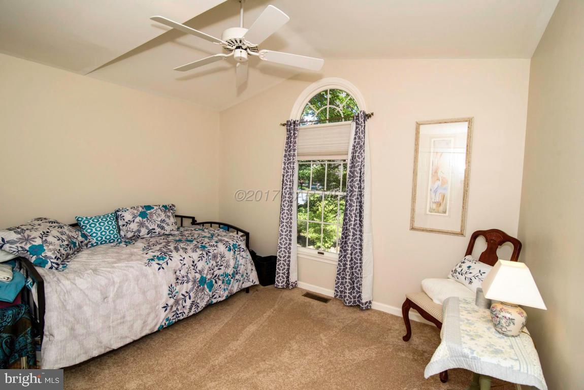 17 Mist Flower Road Ocean Pines, MD 21811 - Photo 36 of 49 a bedroom with a bed and a window