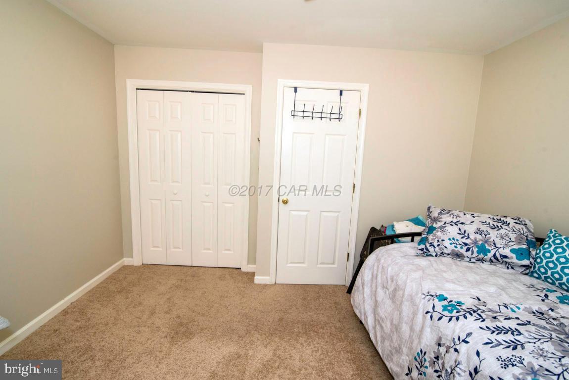 17 Mist Flower Road Ocean Pines, MD 21811 - Photo 38 of 49 a bedroom with a bed and a window