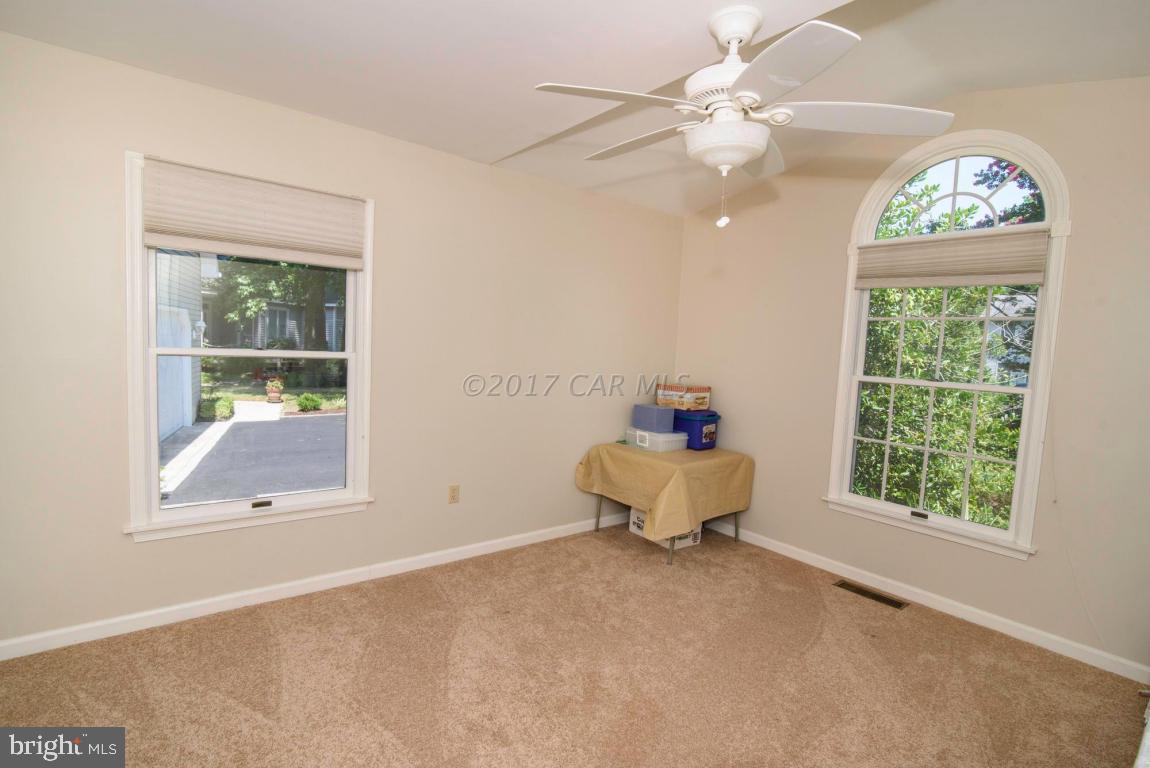 17 Mist Flower Road Ocean Pines, MD 21811 - Photo 40 of 49 an empty room with windows and fan