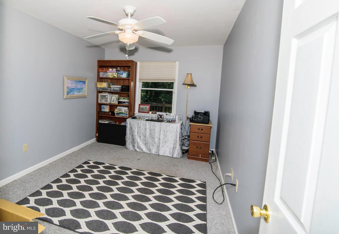 17 Mist Flower Road Ocean Pines, MD 21811 - Photo 41 of 49 a living room with a couch and a chandelier