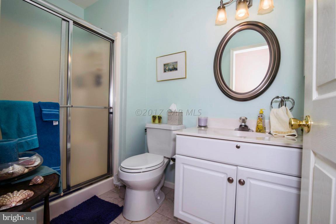 17 Mist Flower Road Ocean Pines, MD 21811 - Photo 42 of 49 a bathroom with a toilet a sink and a mirror