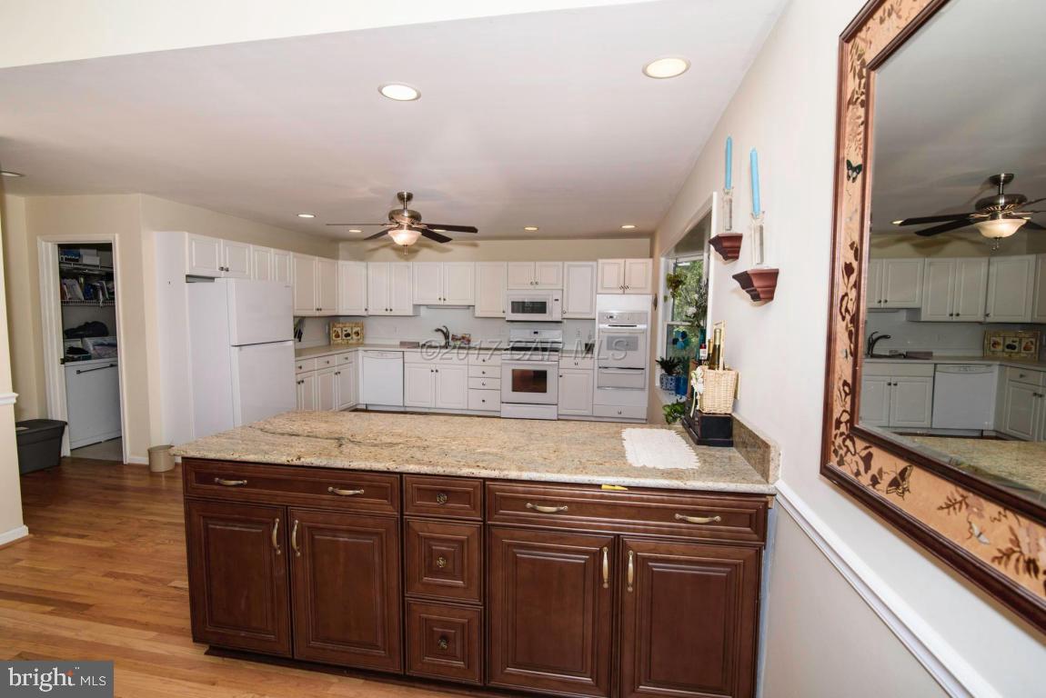 17 Mist Flower Road Ocean Pines, MD 21811 - Photo 9 of 49 a kitchen with kitchen island a counter top space a sink stainless steel appliances and cabinets