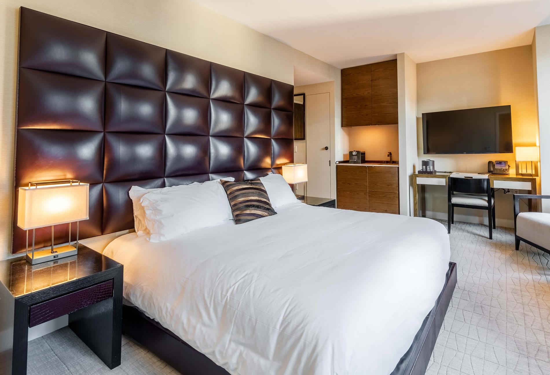 a bed room with a bed and a television