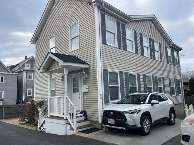 a close view of a sink a table and chair in the kitchen