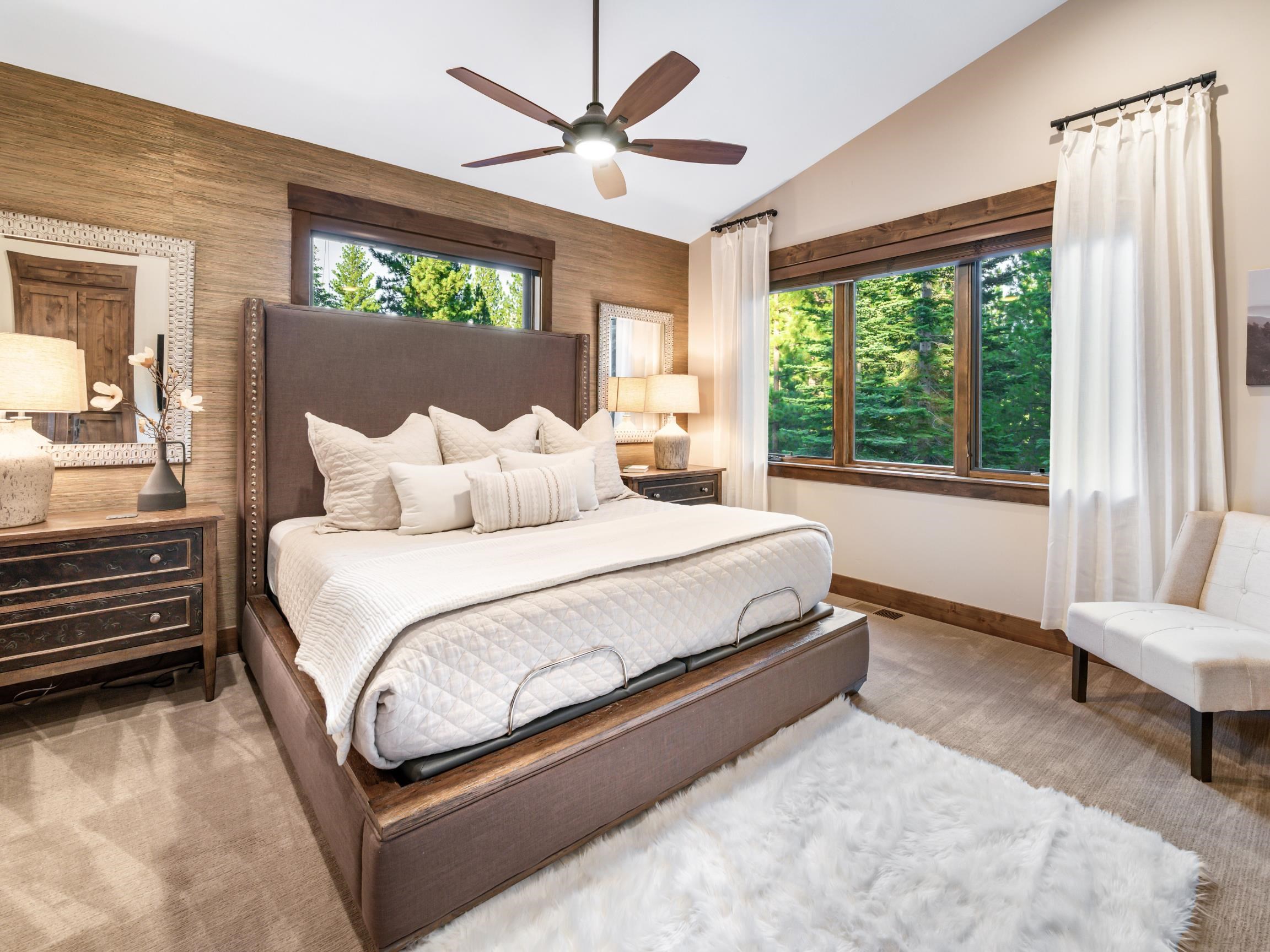 10613 Carson Range Road Truckee, CA 96161 - Photo 11 of 28 a spacious bedroom with a bed and a large window with balcony view