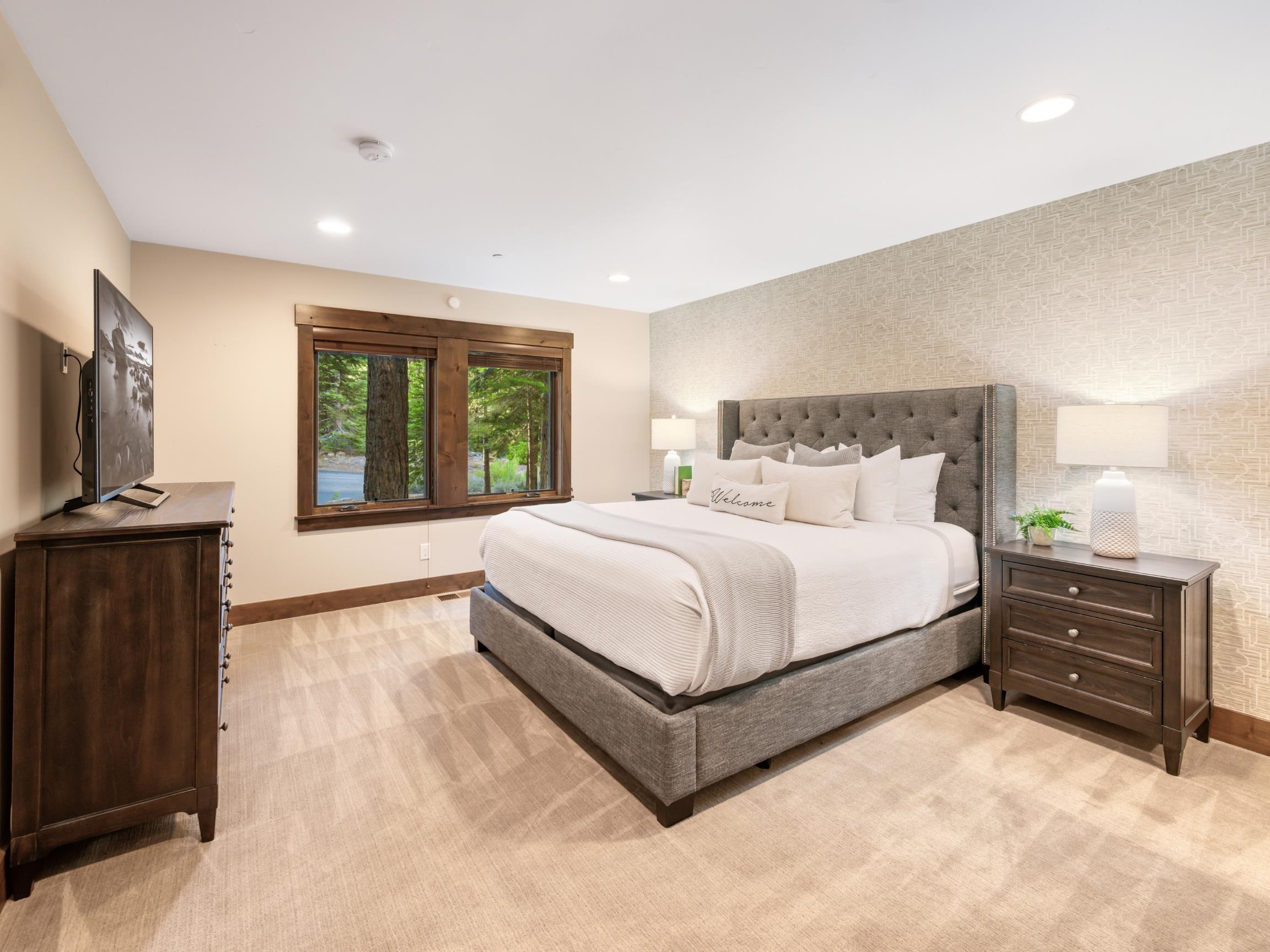 10613 Carson Range Road Truckee, CA 96161 - Photo 18 of 28 a bed room with a bed and a television