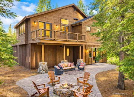 a backyard of a house with outdoor seating