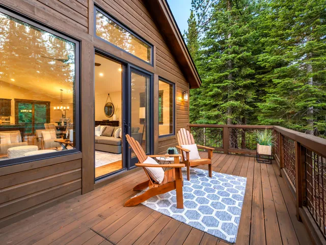 a view of balcony with chairs and wooden floor