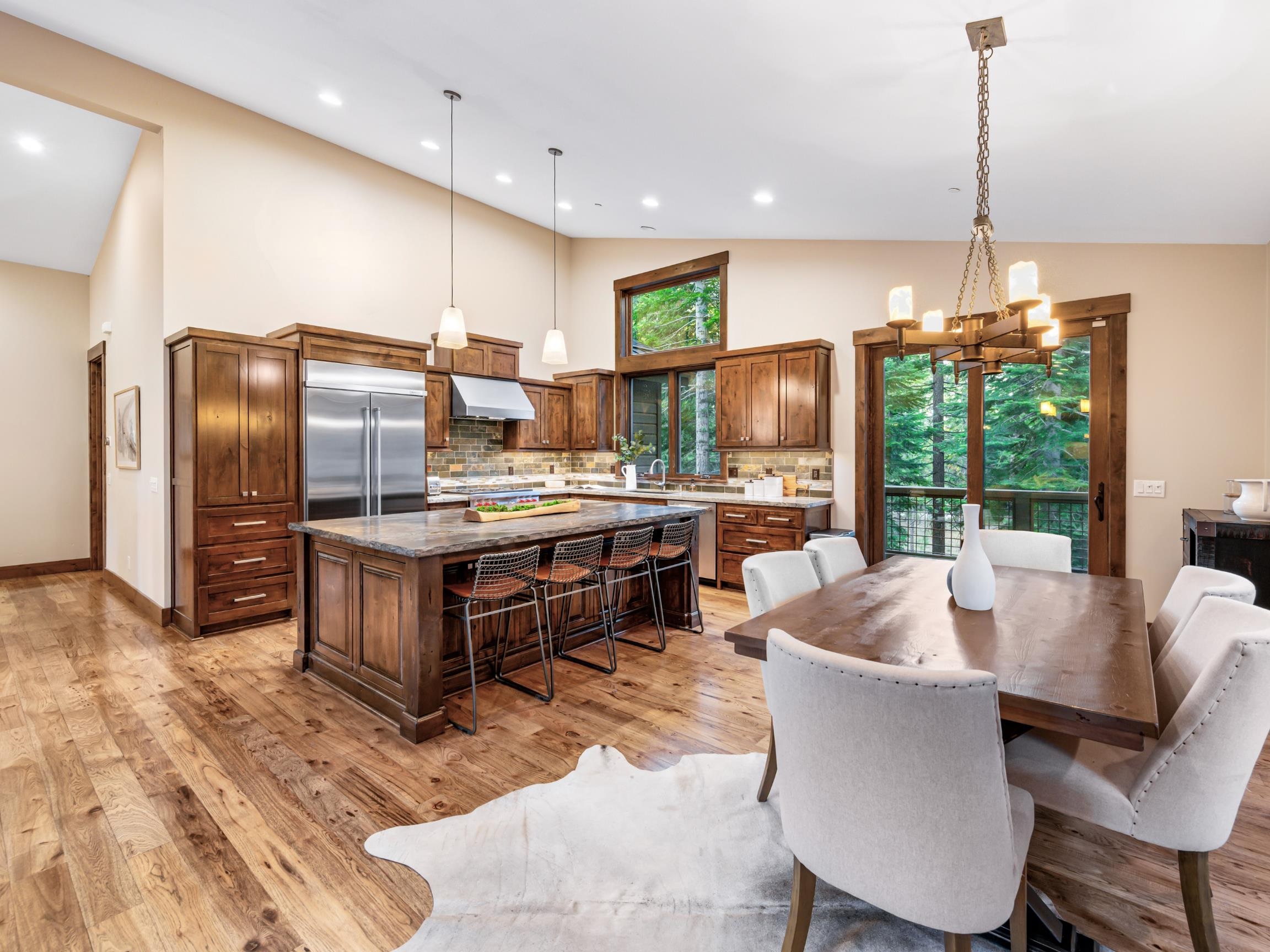 10613 Carson Range Road Truckee, CA 96161 - Photo 10 of 28 a kitchen with kitchen island a large counter top space appliances and a center island