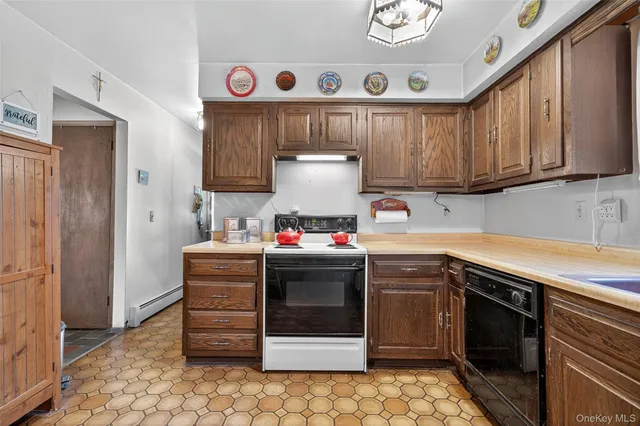 a kitchen with stainless steel appliances granite countertop a stove and a refrigerator