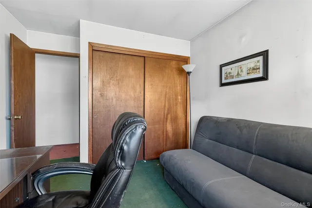 a living room with furniture and a gate