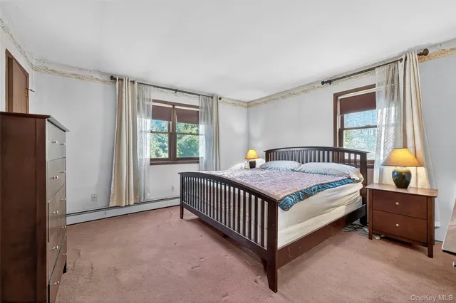 a bed room with a bed and a window